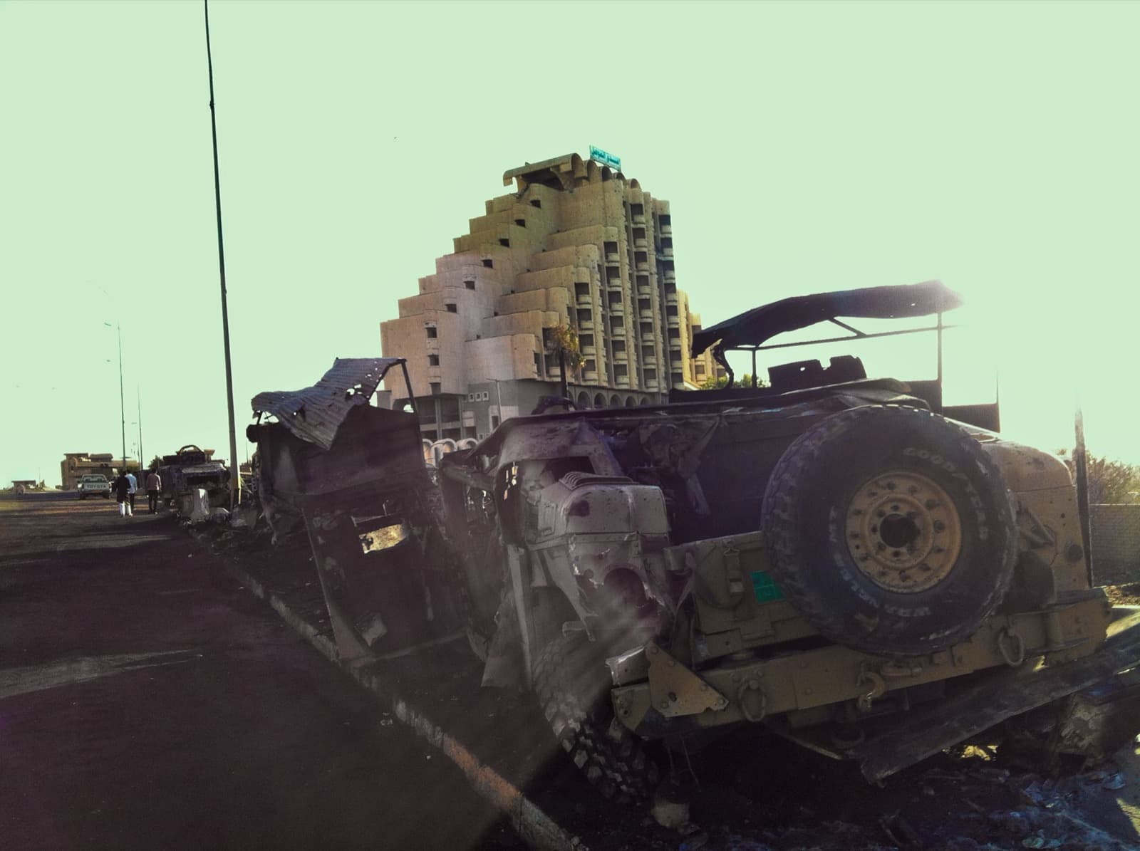 Burnt-out Iraqi army Humvees by a hotel in Mosul